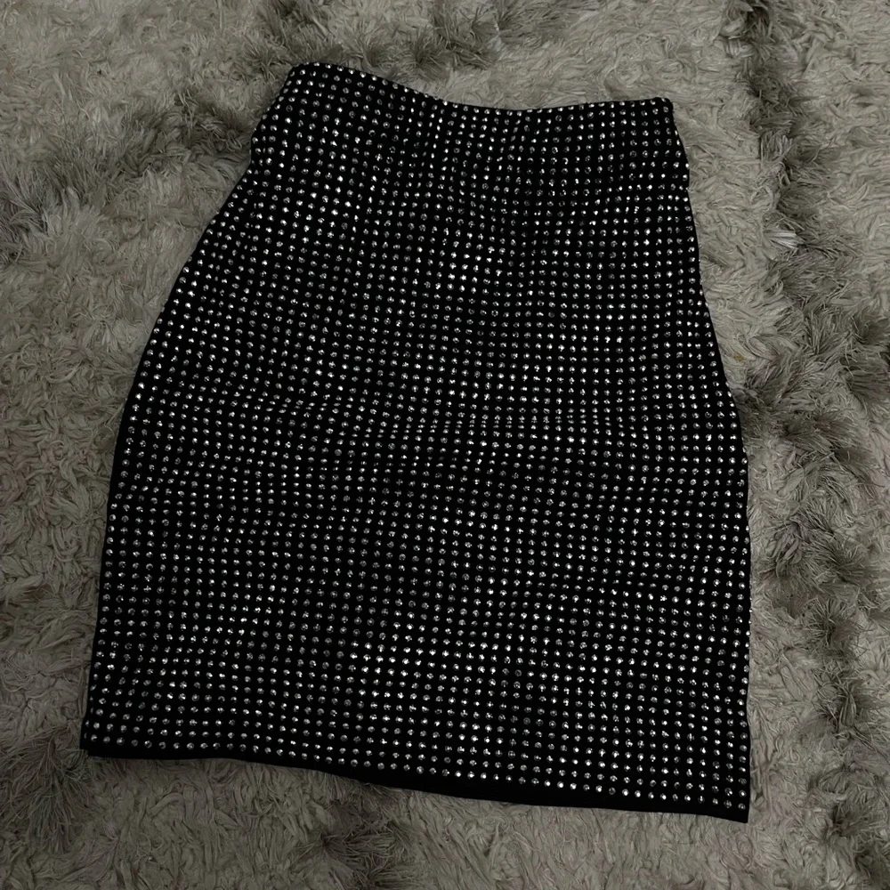 Black rhinestone mini skirt